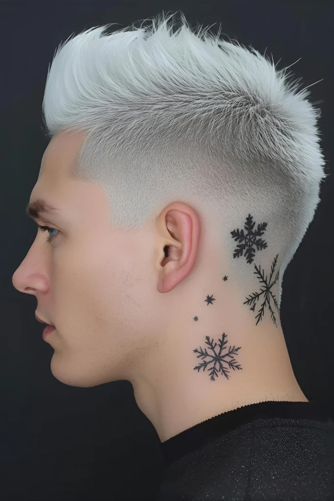 Icy Undercut with Design Completely platinum hair on top contrasts with shaved sides featuring winter-inspired designs like snowflakes or geometric pat