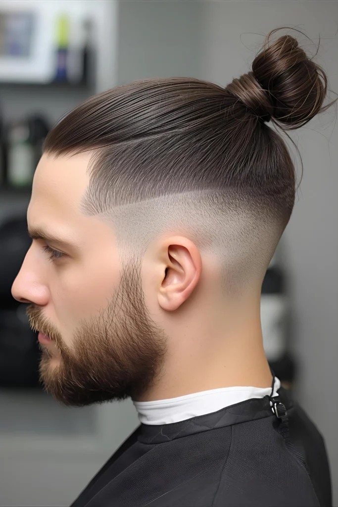 Man Bun Taper The practical and popular man bun gets a sharp upgrade. The taper keeps the sides and back neat, highlighting the bun and keeping the look tidy.