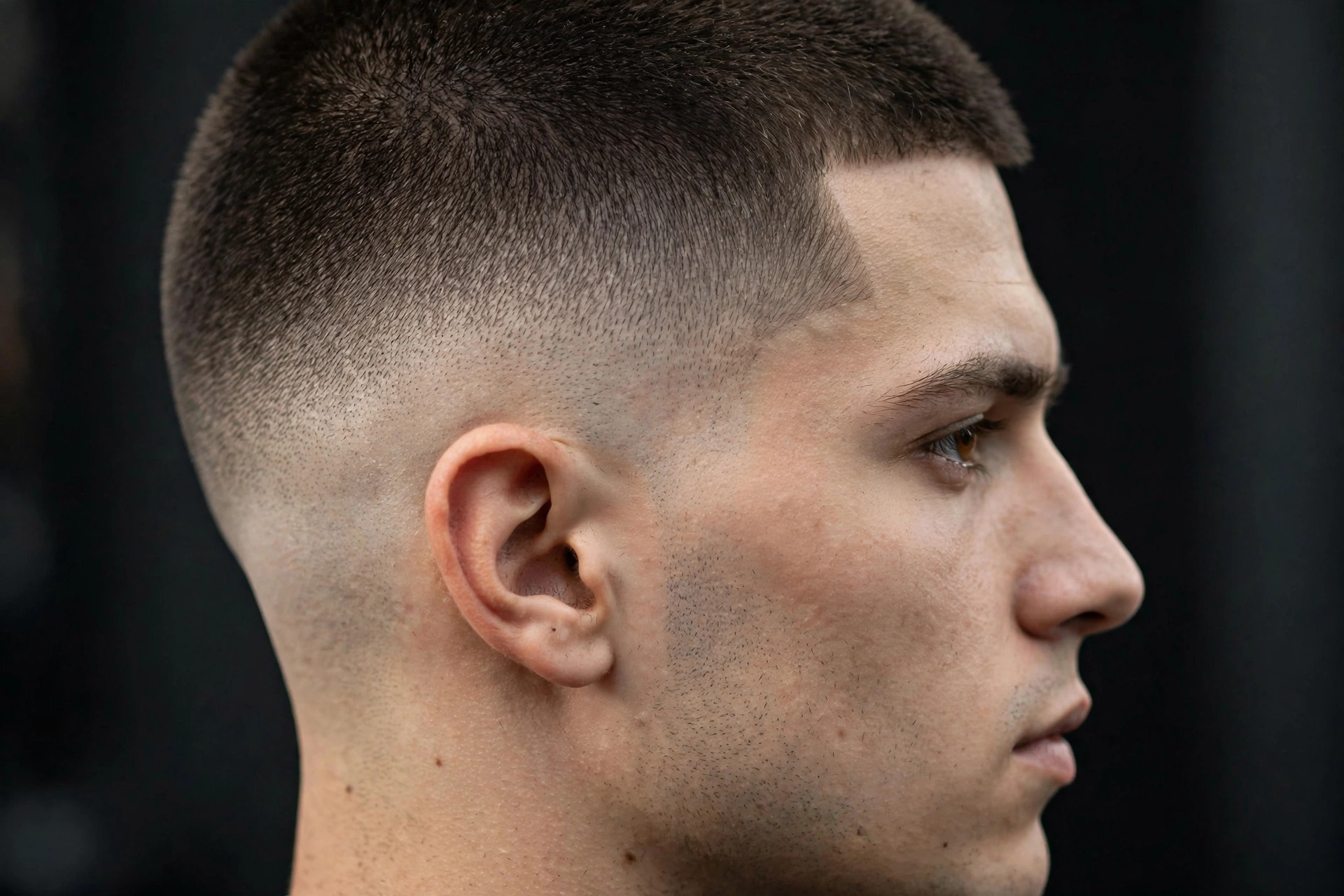high and tight with flawless skin fade transition, barber detail shot of the blend